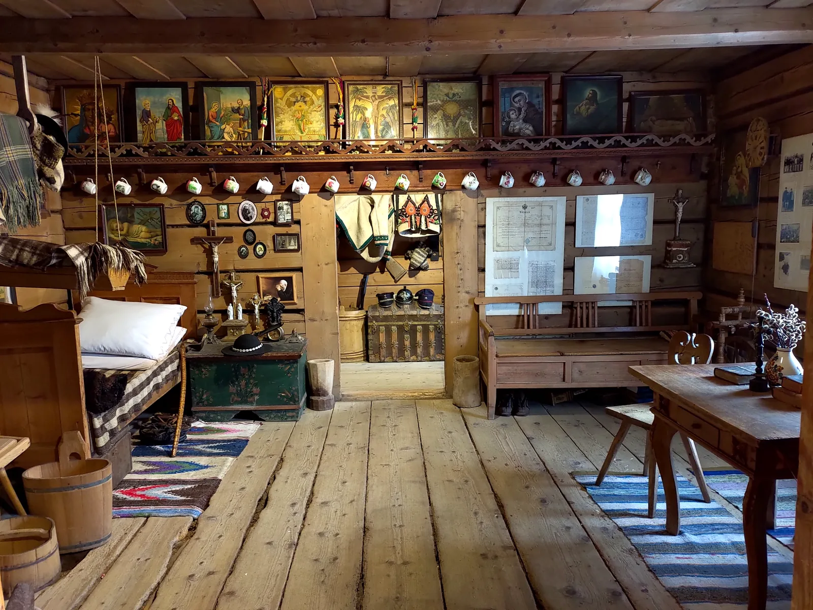Traditional wooden house interior with highlander folk objects in Chochołów