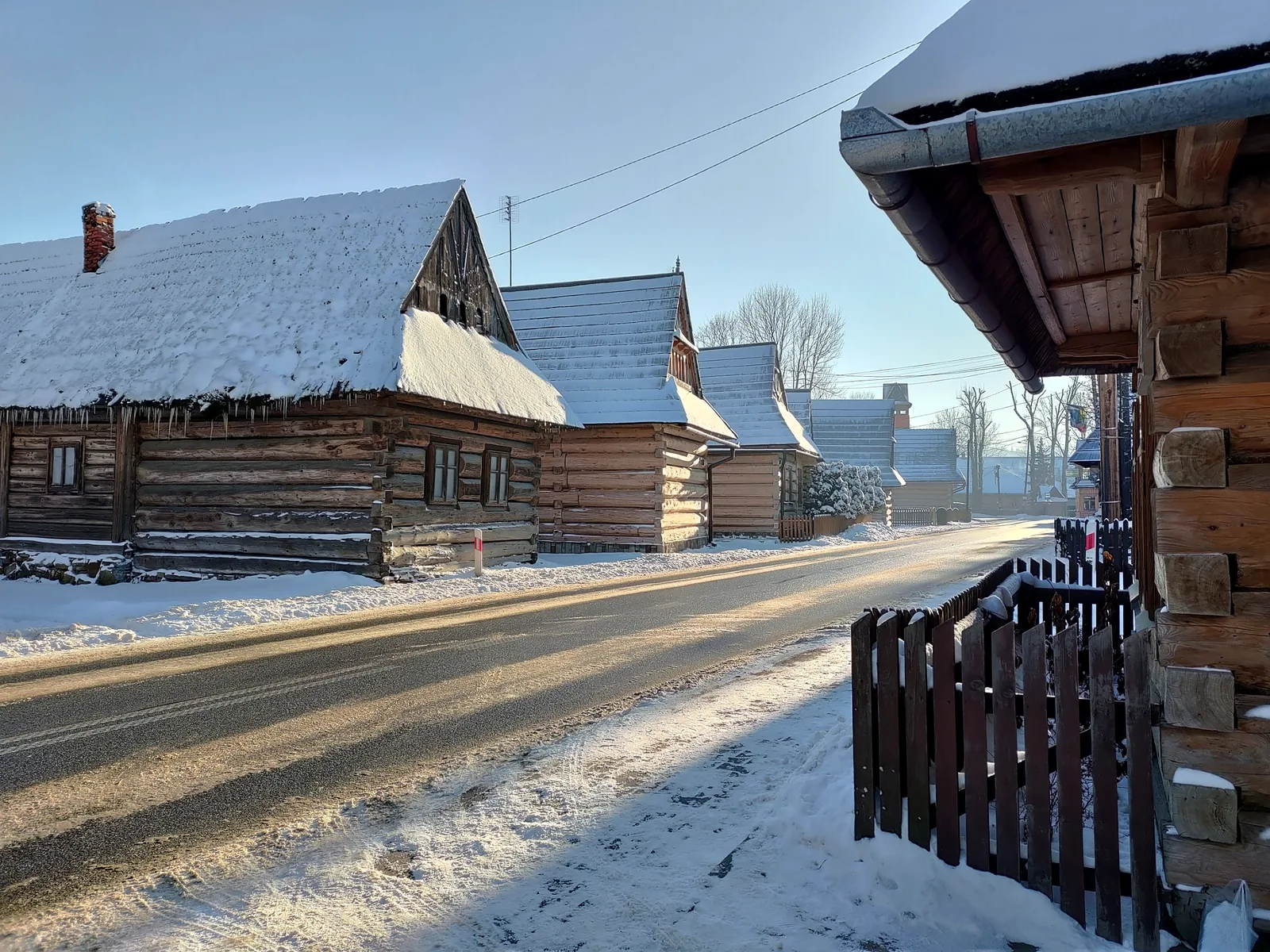 Traditional wooden houses in Chochołów village during winter